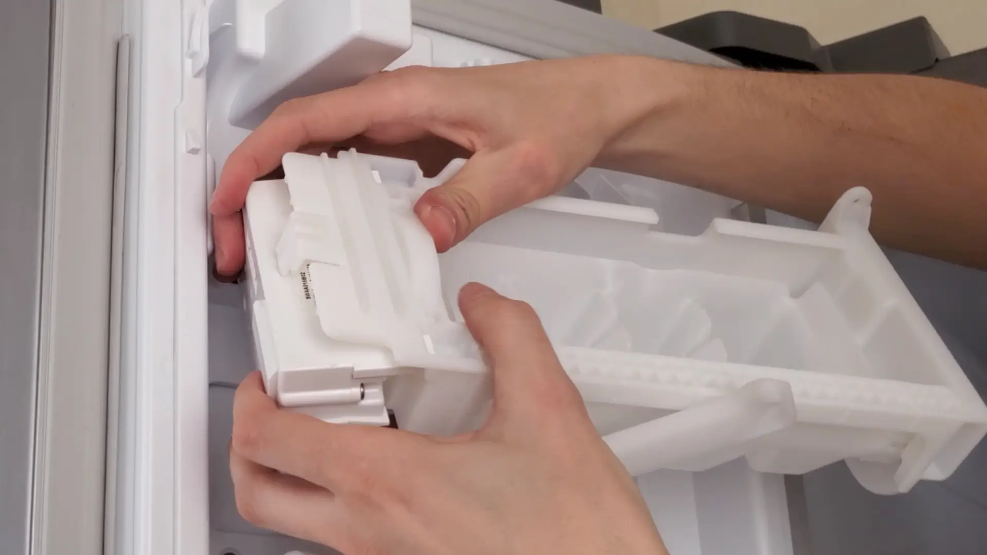 inserting the ice tray back