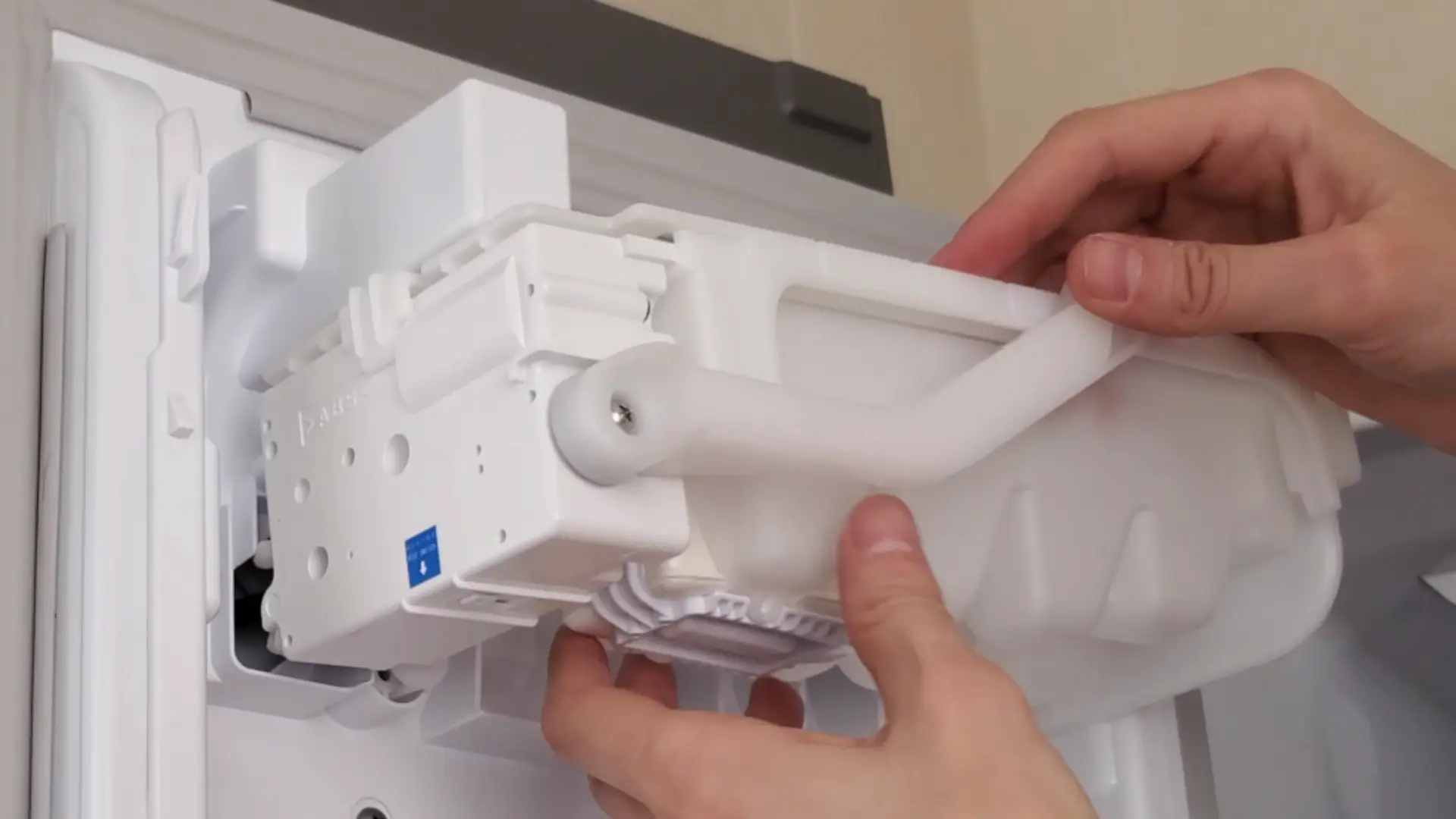 inserting the ice tray back